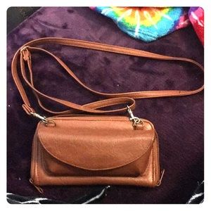 Small leather wallet with strap.